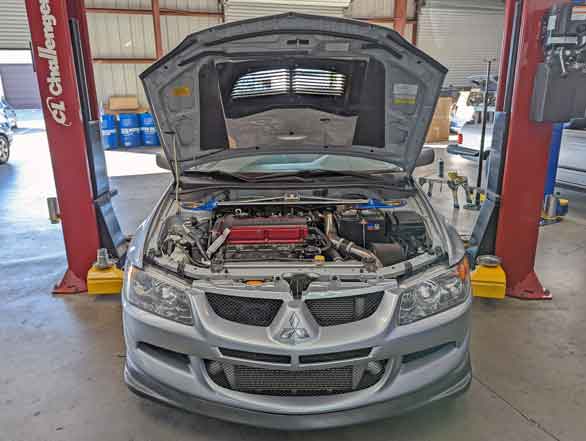 Mitsubishi Evo with the hood open.
